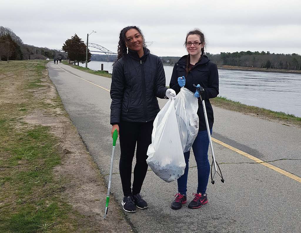 Volunteers from AmeriCorps, Cape Cod pick up trash along the banks of the Cape Cod Canal during the Cape Cod Canal Clean up event, April 22, 2017