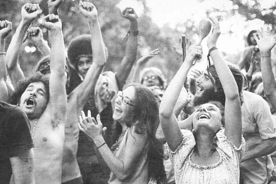 Happy people at Woodstock Music and Art Fair. Unknown photographer.